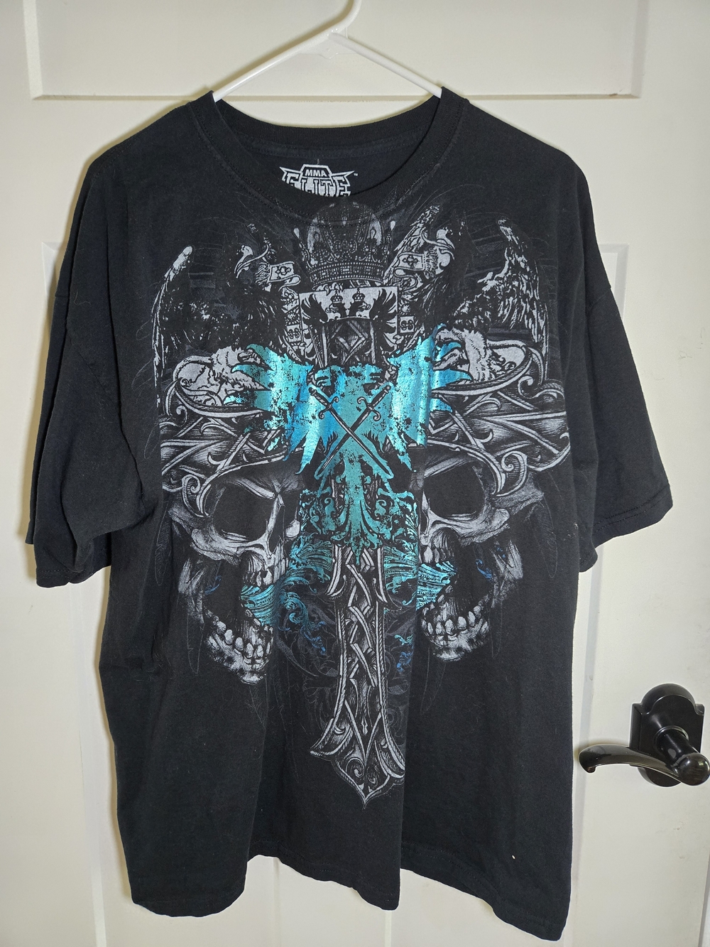 Black Men’s Graphic Skull Tee with Teal Cross Accent